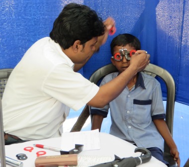 Eye clinic for village kids at Dharmada – India